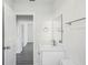 Bathroom featuring modern fixtures, stone countertops, and a neutral color palette at 2288 Cheryl Rd, Largo, FL 33771