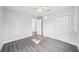 This bedroom features neutral walls, the new flooring throughout, and an adjoining door at 2288 Cheryl Rd, Largo, FL 33771