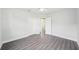 Bright bedroom with hardwood floors, a closet, and white walls at 2288 Cheryl Rd, Largo, FL 33771