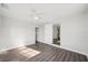 A bright bedroom featuring stylish flooring, fresh paint, modern ceiling fan and neutral finishes at 2288 Cheryl Rd, Largo, FL 33771