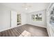 Sunlit bedroom boasts new floors and a large window, offering a bright and airy atmosphere at 2288 Cheryl Rd, Largo, FL 33771