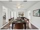 Dining room featuring long wooden table with seating for eight and minimalist decor at 2288 Cheryl Rd, Largo, FL 33771