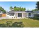 Charming single-story home with a well-maintained lawn and minimalist landscaping, offering great curb appeal at 2288 Cheryl Rd, Largo, FL 33771