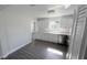Updated kitchen with white cabinets, stainless steel appliances and gray plank flooring at 2288 Cheryl Rd, Largo, FL 33771