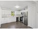 Updated kitchen featuring stainless steel appliances and bright white cabinetry at 2288 Cheryl Rd, Largo, FL 33771