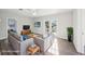 Bright, staged living room with neutral colors and a patio door leading to the outside at 2288 Cheryl Rd, Largo, FL 33771