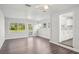 Bright living room featuring large windows, new floors, and neutral colors at 2288 Cheryl Rd, Largo, FL 33771
