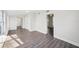 Spacious living room featuring wood-look flooring, light gray walls, and natural light at 2288 Cheryl Rd, Largo, FL 33771