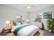 Comfortable bedroom featuring two windows, tasteful decor, neutral walls, and light-colored furnishings at 2288 Cheryl Rd, Largo, FL 33771