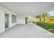 Covered patio with concrete flooring and access to the backyard, perfect for outdoor entertaining at 2288 Cheryl Rd, Largo, FL 33771