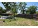 Landscaped back yard, with a brick patio and mature trees to offer shade and privacy at 2486 Hickman Cir, Clearwater, FL 33761