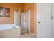 Bathroom with shower and tub enclosed by glass at 2486 Hickman Cir, Clearwater, FL 33761