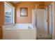 Bathroom with shower, tub and window with natural lighting at 2486 Hickman Cir, Clearwater, FL 33761
