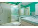 Well-lit bathroom features shower over tub and modern sink at 2486 Hickman Cir, Clearwater, FL 33761
