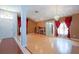 Open living room with hardwood floors, a fireplace, and elegant decor at 2486 Hickman Cir, Clearwater, FL 33761