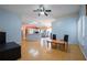 Open-concept living room and kitchen with wood floors, natural light, and plenty of space at 2486 Hickman Cir, Clearwater, FL 33761