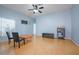 Living room with ceiling fan, window coverings and neutral paint and flooring at 2486 Hickman Cir, Clearwater, FL 33761