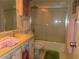 Bathroom with vanity, toilet, towel racks, pink towels and shower/tub combo at 2618 Cove Cay Dr # 403, Clearwater, FL 33760
