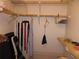 Walk-in closet with metal shelving and hanging rods offers ample storage space for clothes and accessories at 2618 Cove Cay Dr # 403, Clearwater, FL 33760