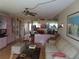 Living space with sofa, glass table, and view into dining and kitchen areas at 2618 Cove Cay Dr # 403, Clearwater, FL 33760