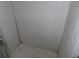 Image shows the shower surround is tiled with white square tiles, and appears to be dirty and old at 2618 Cove Cay Dr # 403, Clearwater, FL 33760