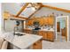 Well-appointed kitchen with ample cabinet space, granite countertops, and stainless steel appliances for culinary enthusiasts at 2932 Chelsea Woods Dr, Valrico, FL 33596