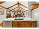 Open-concept kitchen overlooking the living room, featuring modern appliances and a seamless design at 2932 Chelsea Woods Dr, Valrico, FL 33596