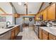 Spacious kitchen featuring granite countertops, stainless steel appliances, and hardwood floors for a modern touch at 2932 Chelsea Woods Dr, Valrico, FL 33596