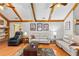 Cozy living room featuring vaulted ceilings, hardwood floors, and comfortable seating arrangements for relaxation at 2932 Chelsea Woods Dr, Valrico, FL 33596