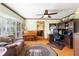 Inviting living room features a piano, desk, and comfortable seating at 2932 Chelsea Woods Dr, Valrico, FL 33596