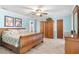 Serene main bedroom featuring pastel walls, wood-look tile floors, and natural light for a relaxing retreat at 2932 Chelsea Woods Dr, Valrico, FL 33596