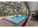 Lovely screened-in pool and patio area with ceiling fan for comfortable outdoor living at 2932 Chelsea Woods Dr, Valrico, FL 33596