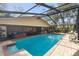 Beautiful backyard pool area including a hot tub and screened-in enclosure at 2932 Chelsea Woods Dr, Valrico, FL 33596