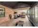 Enclosed poolside patio with brick flooring, hot tub, and outdoor storage at 2932 Chelsea Woods Dr, Valrico, FL 33596