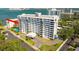 Waterfront condominium with multiple balconies, lush landscaping, and a convenient circular driveway at 30 Turner St # 604, Clearwater, FL 33756