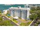 Waterfront condominium with multiple balconies, lush landscaping, and a convenient circular driveway at 30 Turner St # 604, Clearwater, FL 33756