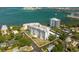 Waterfront condominium with multiple balconies, lush landscaping, and a convenient circular driveway at 30 Turner St # 604, Clearwater, FL 33756