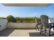 Relaxing balcony seating offers an amazing view of the surrounding trees and the clear blue skies above at 30 Turner St # 604, Clearwater, FL 33756