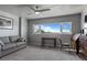 Bedroom featuring a large window with views, a sofa and a desk area at 30 Turner St # 604, Clearwater, FL 33756