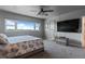 Bedroom featuring a large window and an entertainment center at 30 Turner St # 604, Clearwater, FL 33756