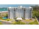 Exterior of a white condo building offering a circular entrance with water views at 30 Turner St # 604, Clearwater, FL 33756