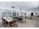 Spacious common area with tables, chairs, couches, and natural light offers flexible space for residents at 30 Turner St # 604, Clearwater, FL 33756