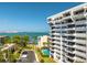 Exterior condo view with pool and cityscape backdrop at 30 Turner St # 604, Clearwater, FL 33756