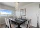 Bright dining room with modern chandelier and a view of the bay at 30 Turner St # 604, Clearwater, FL 33756