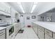 Well-lit kitchen with white appliances and ample counter space provides a functional space for meal preparation at 30 Turner St # 604, Clearwater, FL 33756