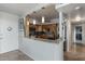 Contemporary kitchen with stainless steel appliances, light wood cabinets, marble countertops and backsplash at 30 Turner St # 604, Clearwater, FL 33756
