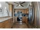 Charming kitchen featuring stainless steel appliances, light wood cabinets, and marble countertops at 30 Turner St # 604, Clearwater, FL 33756