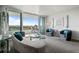 Open living room boasts a serene color palette, balcony access and lots of natural light at 30 Turner St # 604, Clearwater, FL 33756