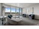 Bright living room with a large sliding glass door opening to a balcony with city views at 30 Turner St # 604, Clearwater, FL 33756