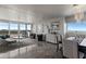 Bright living room and dining area with balcony access and water views at 30 Turner St # 604, Clearwater, FL 33756